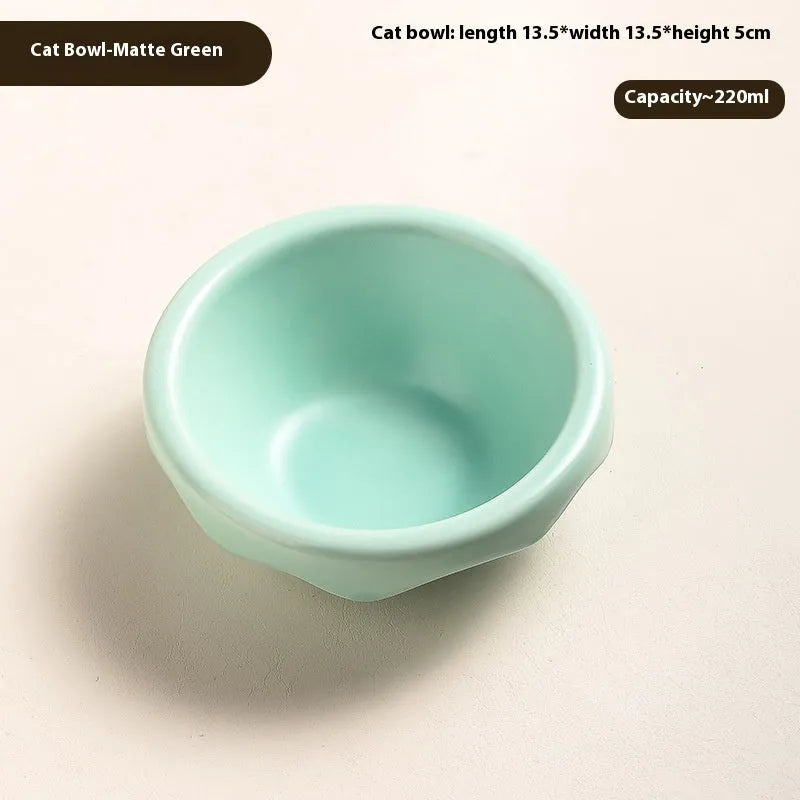 Porcelain cat drinking water bowl in bright red single grid configuration on surface