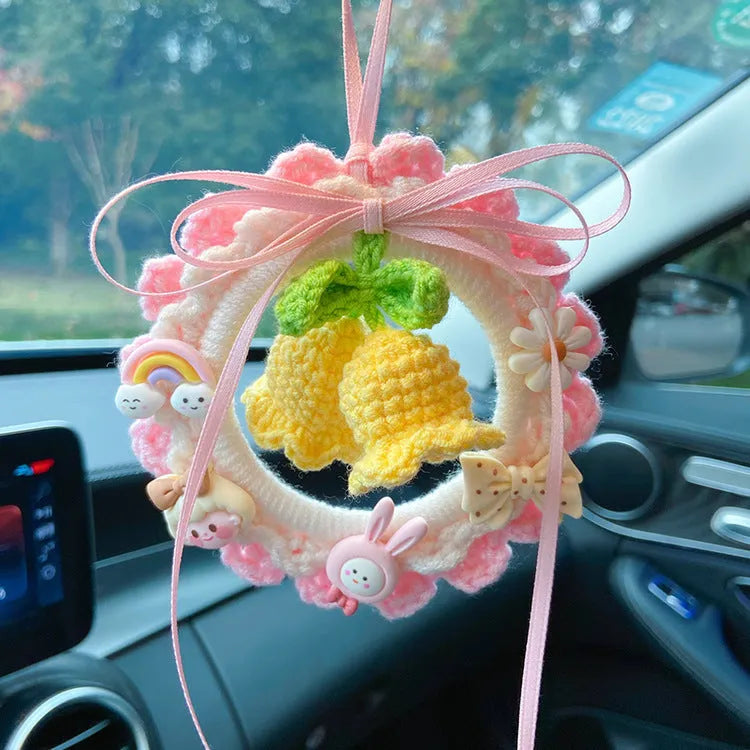 Handmade woven wool bell orchid car hanger pendant in green, pink, purple, and yellow colour options.