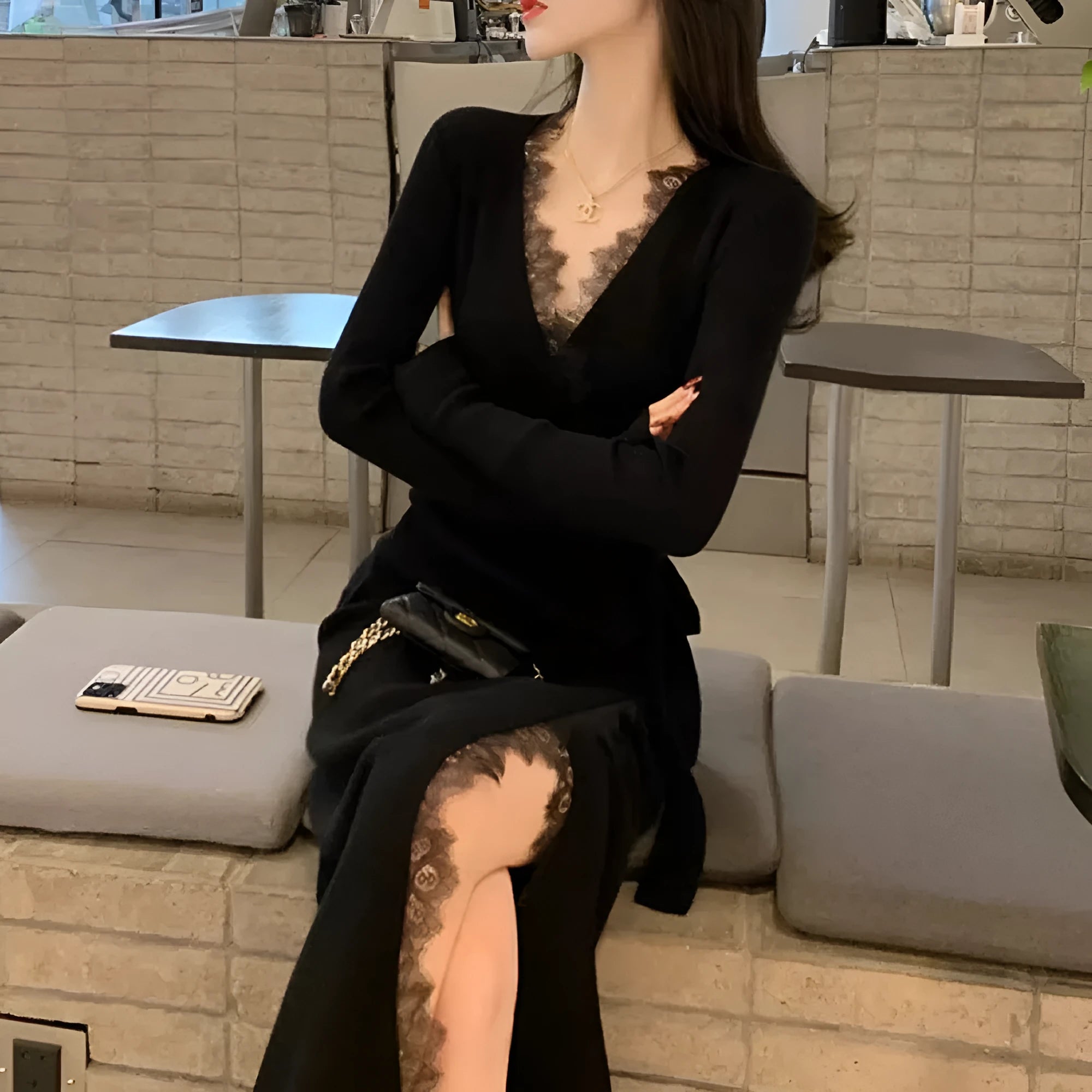 Women's solid black slim fit wool princess dress skirt on a hanger.