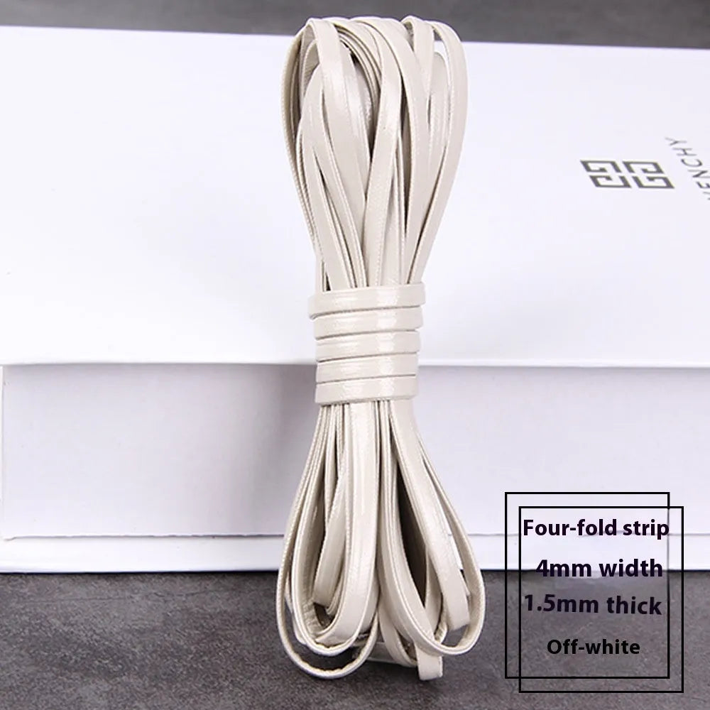 Coils of woven PU leather craft cord in various colours including black, brown, blue, red, and gold.