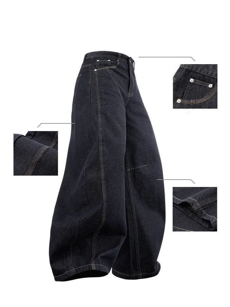 Men's original cow colour wide leg denim trousers laid flat.