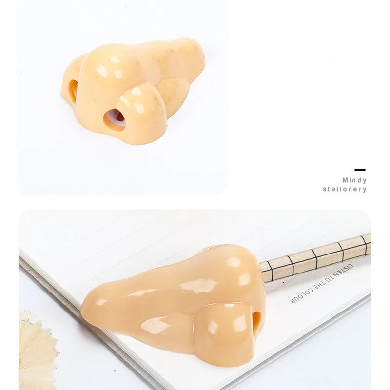Flesh colour plastic geometry-shaped pencil sharpener with large sharpening holes.