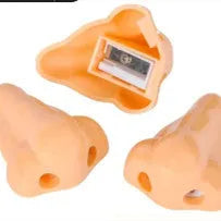 Flesh colour plastic geometry-shaped pencil sharpener with large sharpening holes.