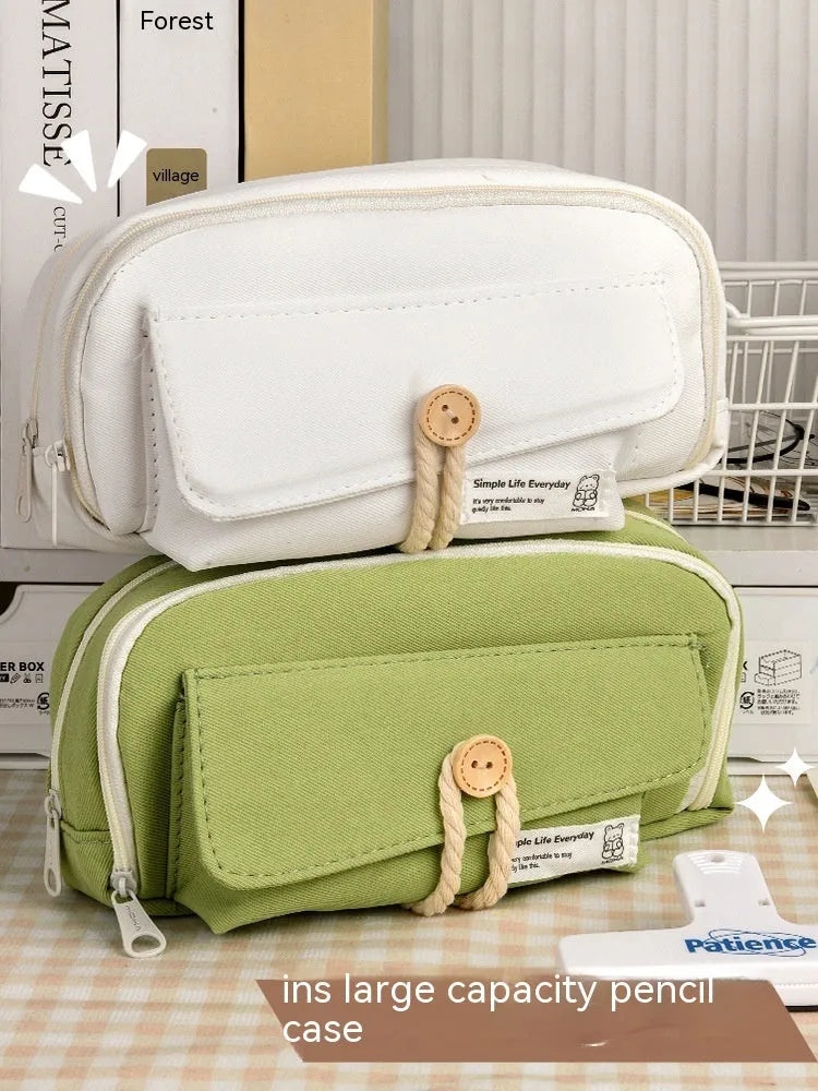 Green canvas pencil case with large capacity for about 80 pens, showing simple Korean style design.
