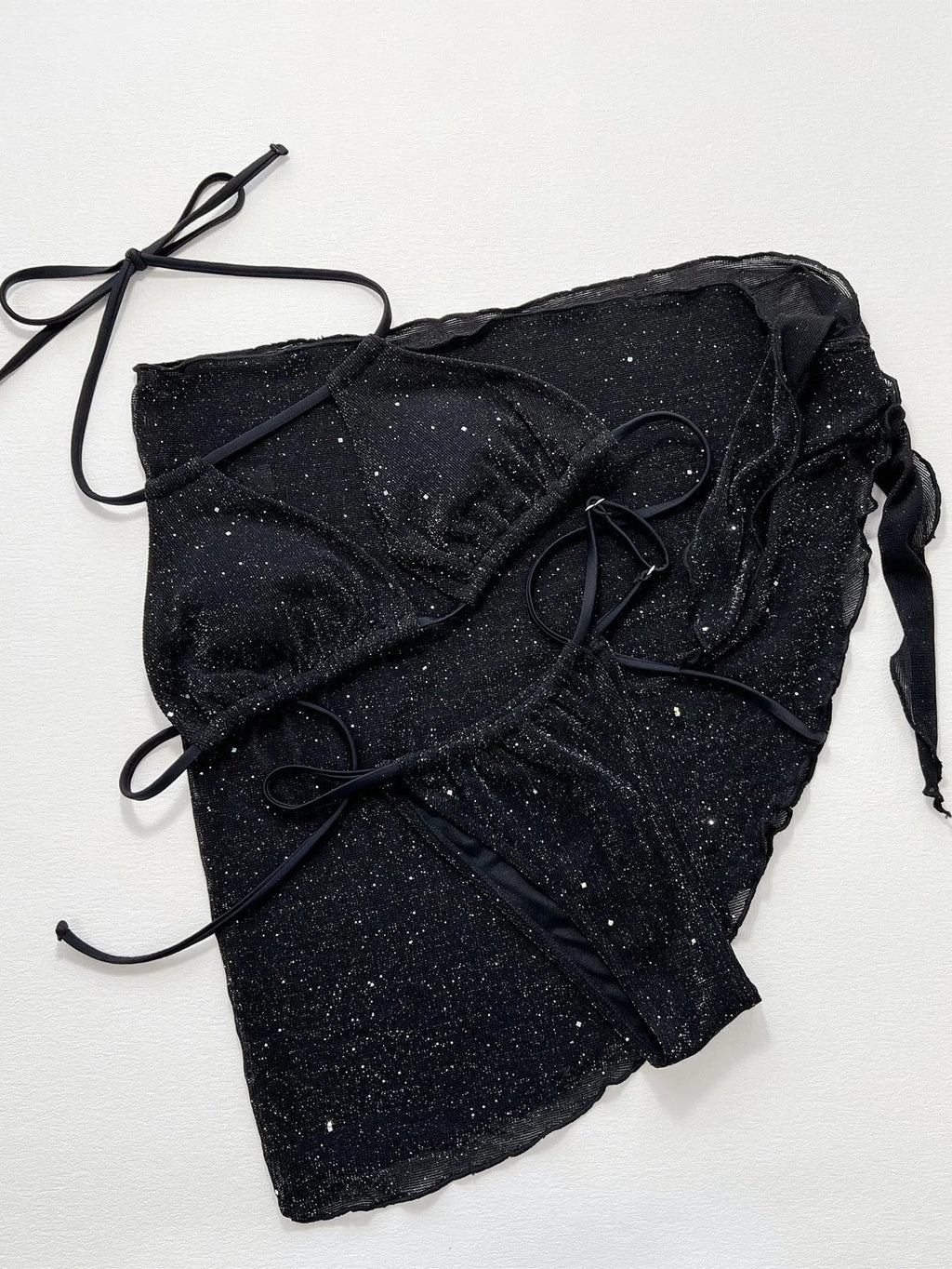 Black three-piece bikini swimsuit set with top and shorts on a mannequin