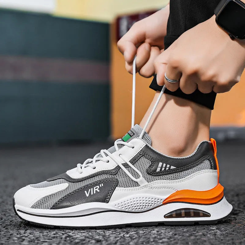 Men's grey breathable mesh running shoes with a round toe and EVA sole on a white background