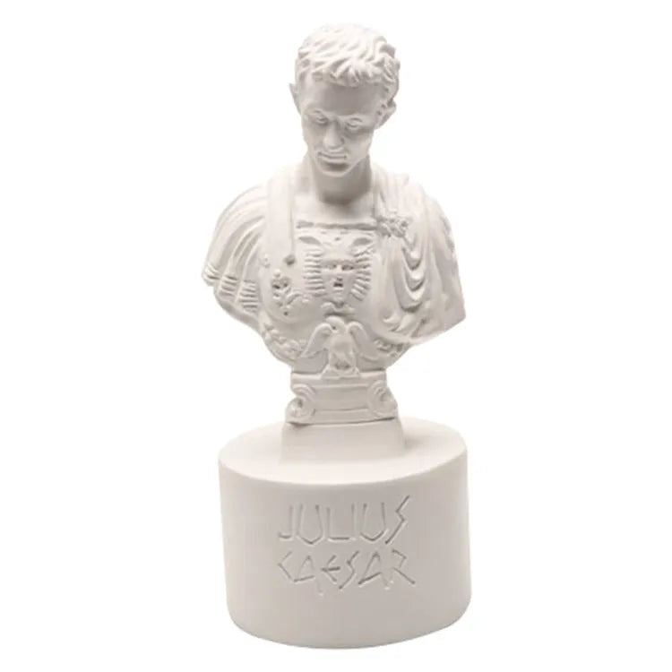 White synthetic resin pen holder with American creative character modelling on a desk.
