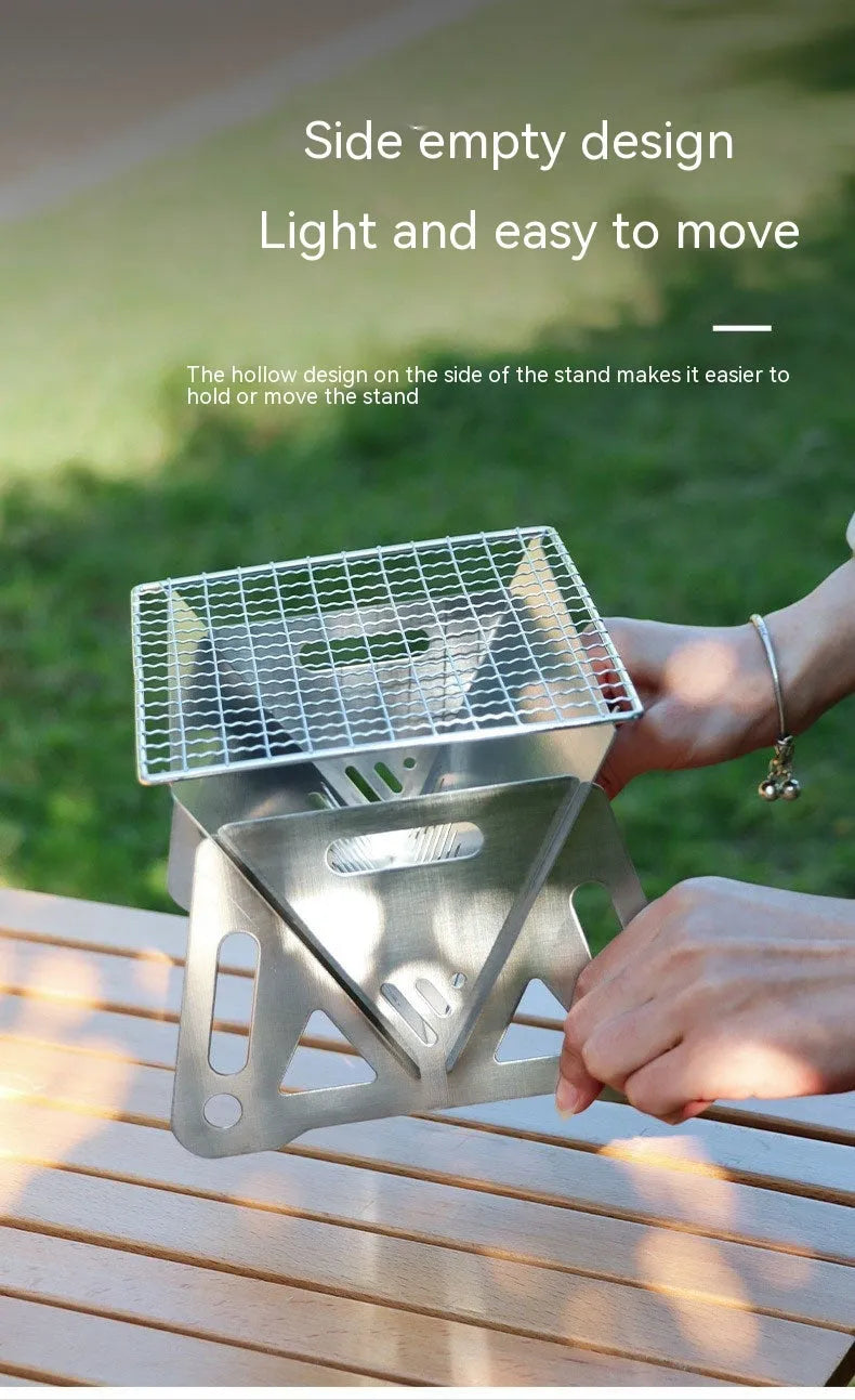 Folding stainless steel outdoor barbecue grill oven with large cooking rack, shown with storage bag.
