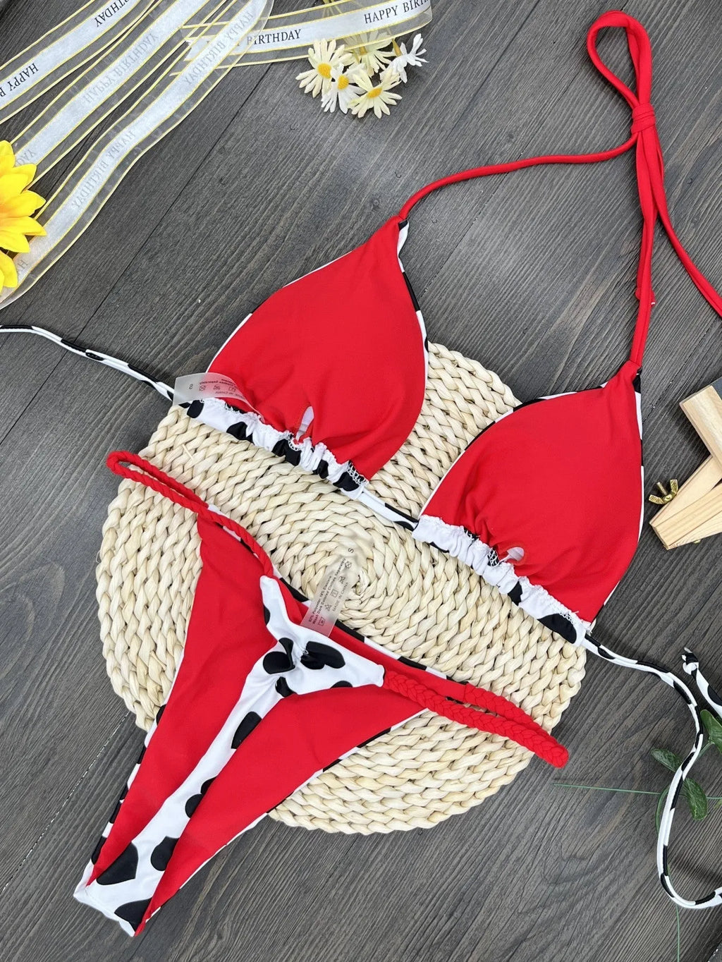 Women's heart print backless swimsuit in briefs style with cotton lining.