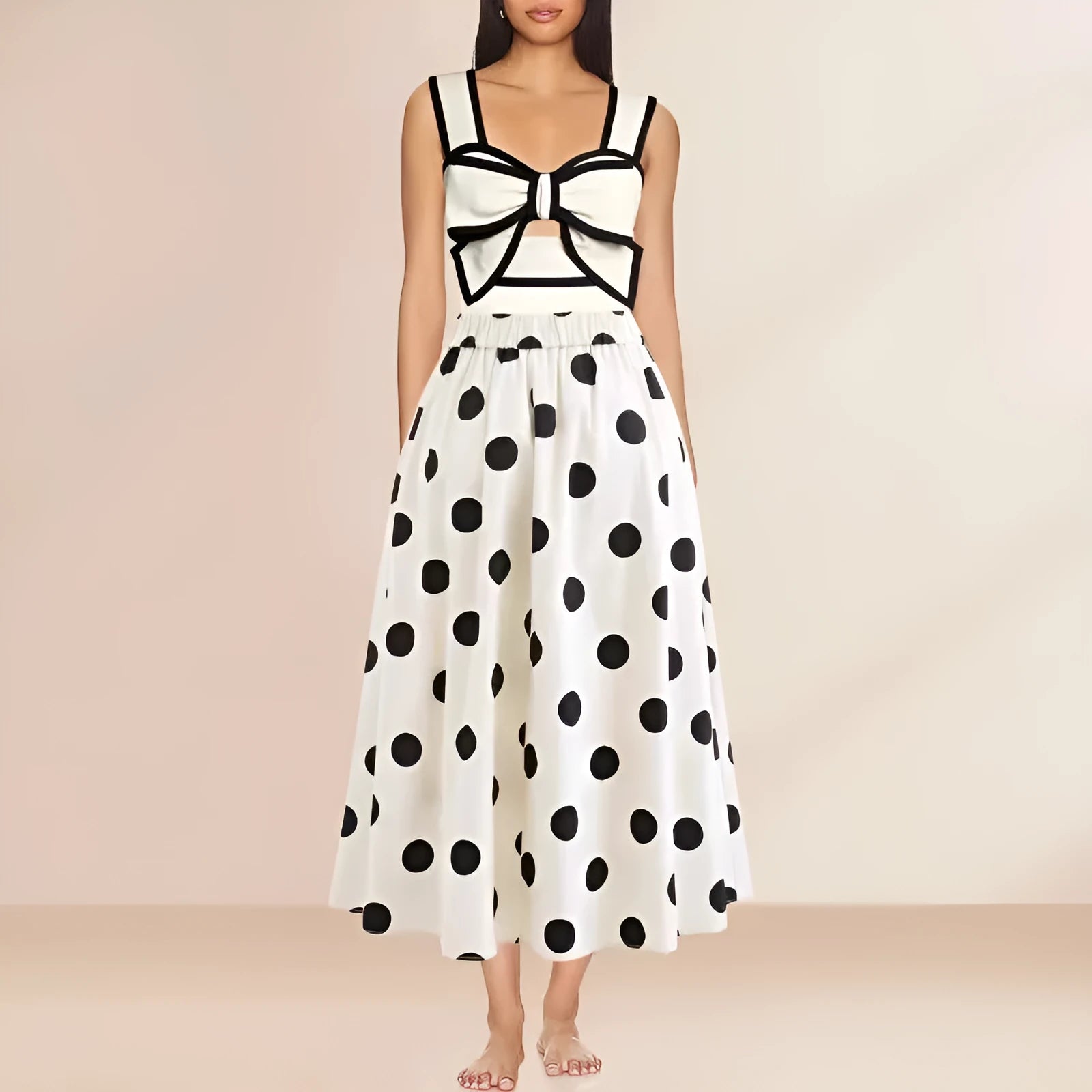 Black one-piece swimsuit for women with a white bow on a short round skirt, showcasing the beach dress style.