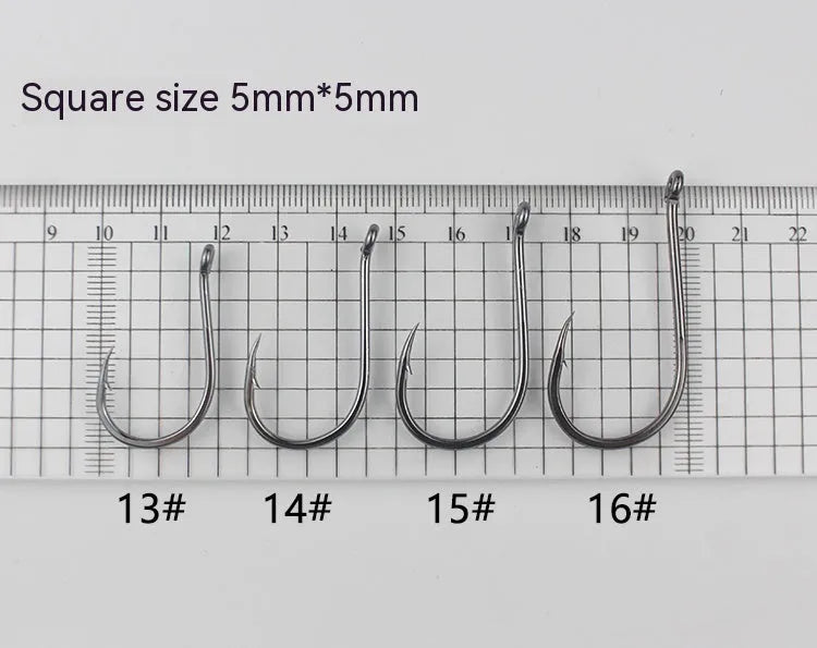 Bulk pack of alloy carbon steel barbed fishing hooks with a hole ring, suitable for rock and sea fishing.