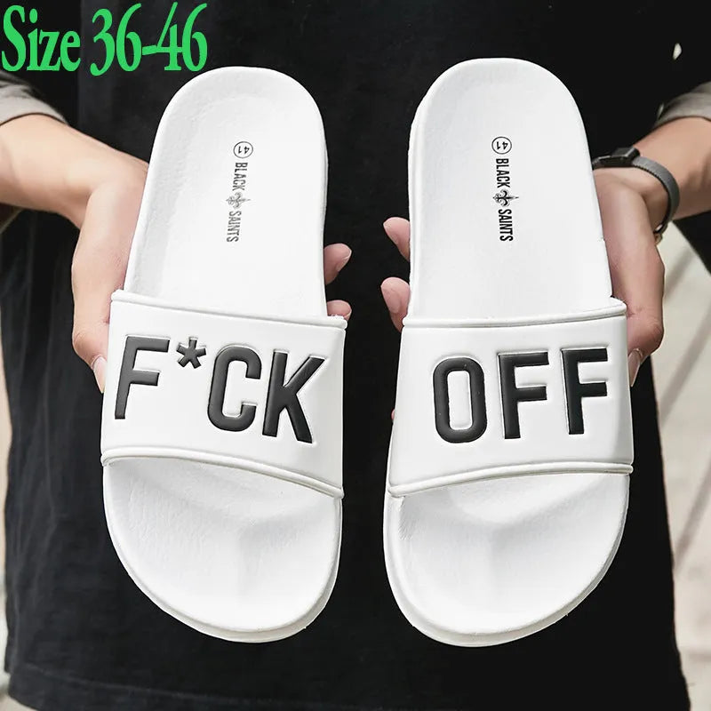 A pair of open-toe men's slippers with a rubber sole, shown in black and white colour options.