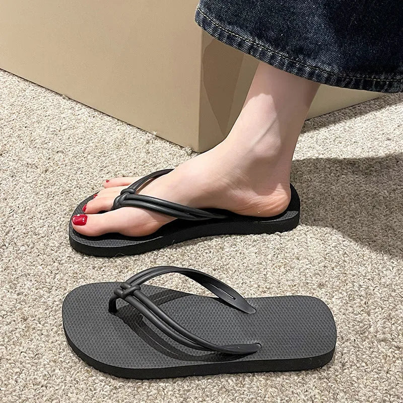 Men's PVC toe-covering flip flops in beige colour on a plain background.
