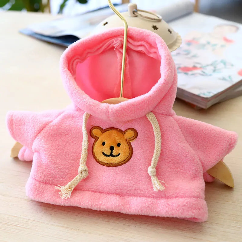 A blue cloth hoodie sweater for a small dog, showing the hood up.