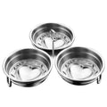 A small, round, heart-shaped stainless steel egg steamer for stovetop use.