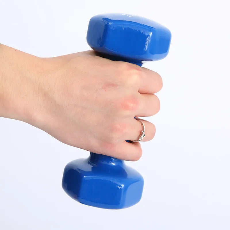 Colourful plastic fitness dumbbells in 0.5kg, 1kg, and 1.5kg weights with glossy surface