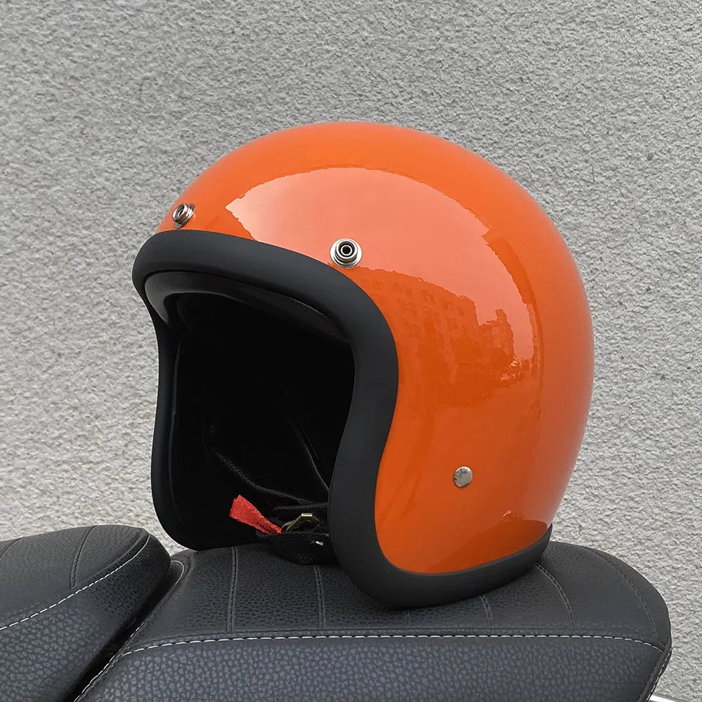 Retro-style motorcycle half helmet in cement grey with a glossy fibreglass shell on a plain background.