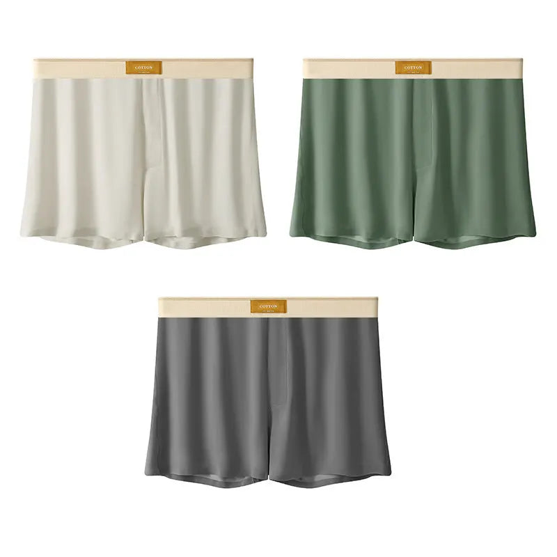 Pack of men's solid colour ice silk boxer shorts showing loose fit and mid-waist design.