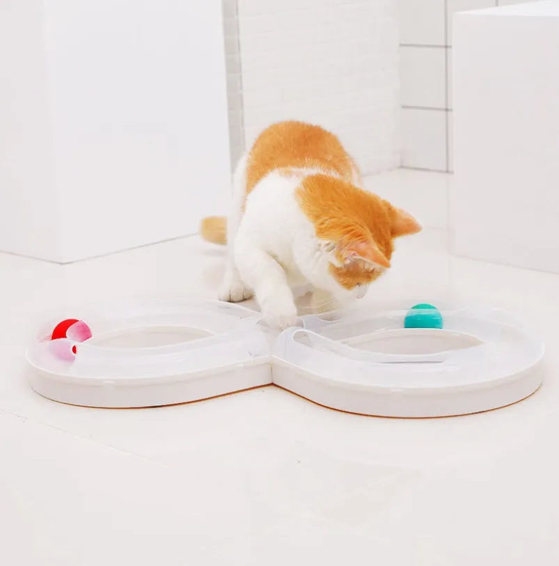 Cat toy turntable with a ball on a circular track, white and blue plastic, 50cm wide, for interactive play