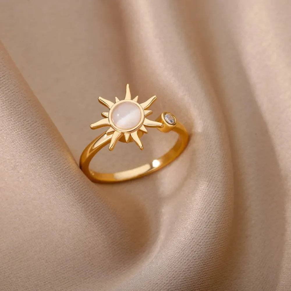 Adjustable decompression ring with rotatable band in gold or platinum finish