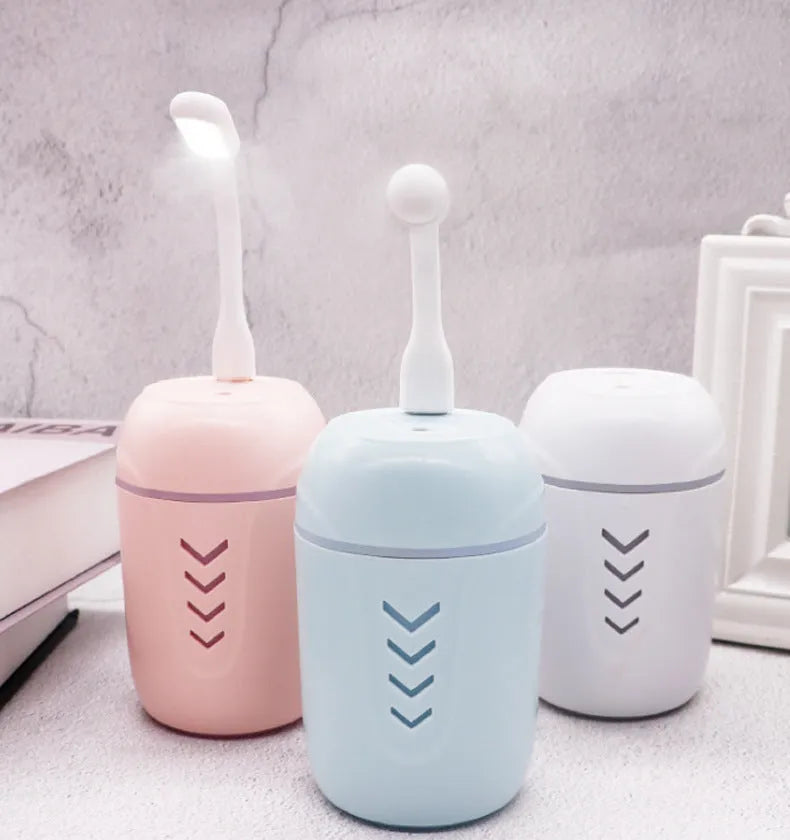 Blue columnar portable car humidifier with USB cable and 200ml water tank.
