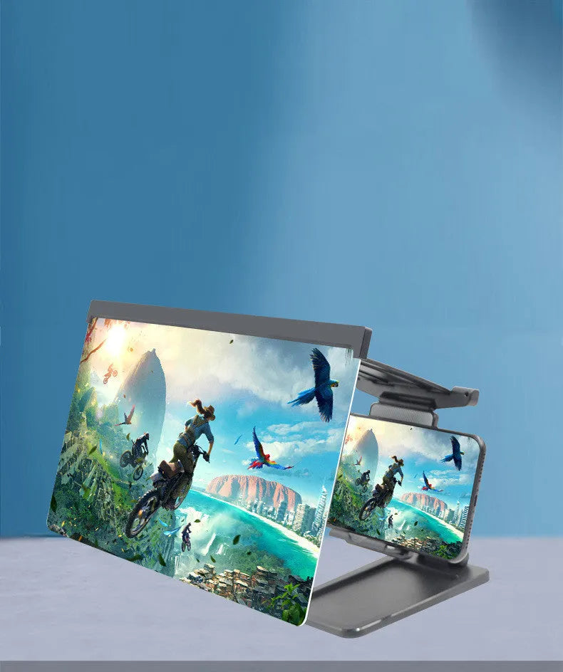 Black foldable mobile phone screen magnifier with detachable phone holder shown on a desktop.