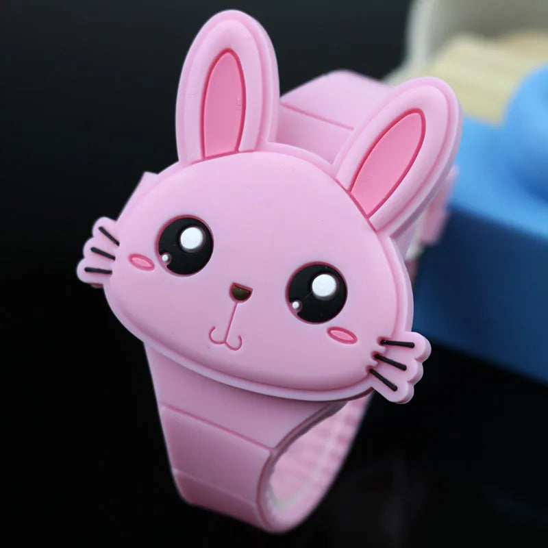 Children's electronic watch with 55mm plastic dial and silicone strap on a child's wrist