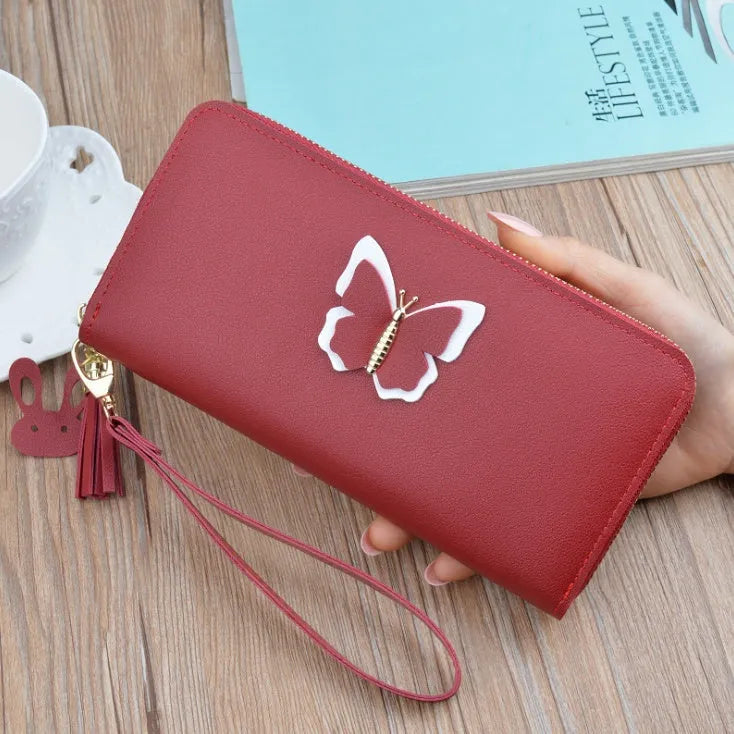 Women's long zip wallet in PU leather with polyester lining, 19.5 x 9.5 x 2.5 cm, shown in green.