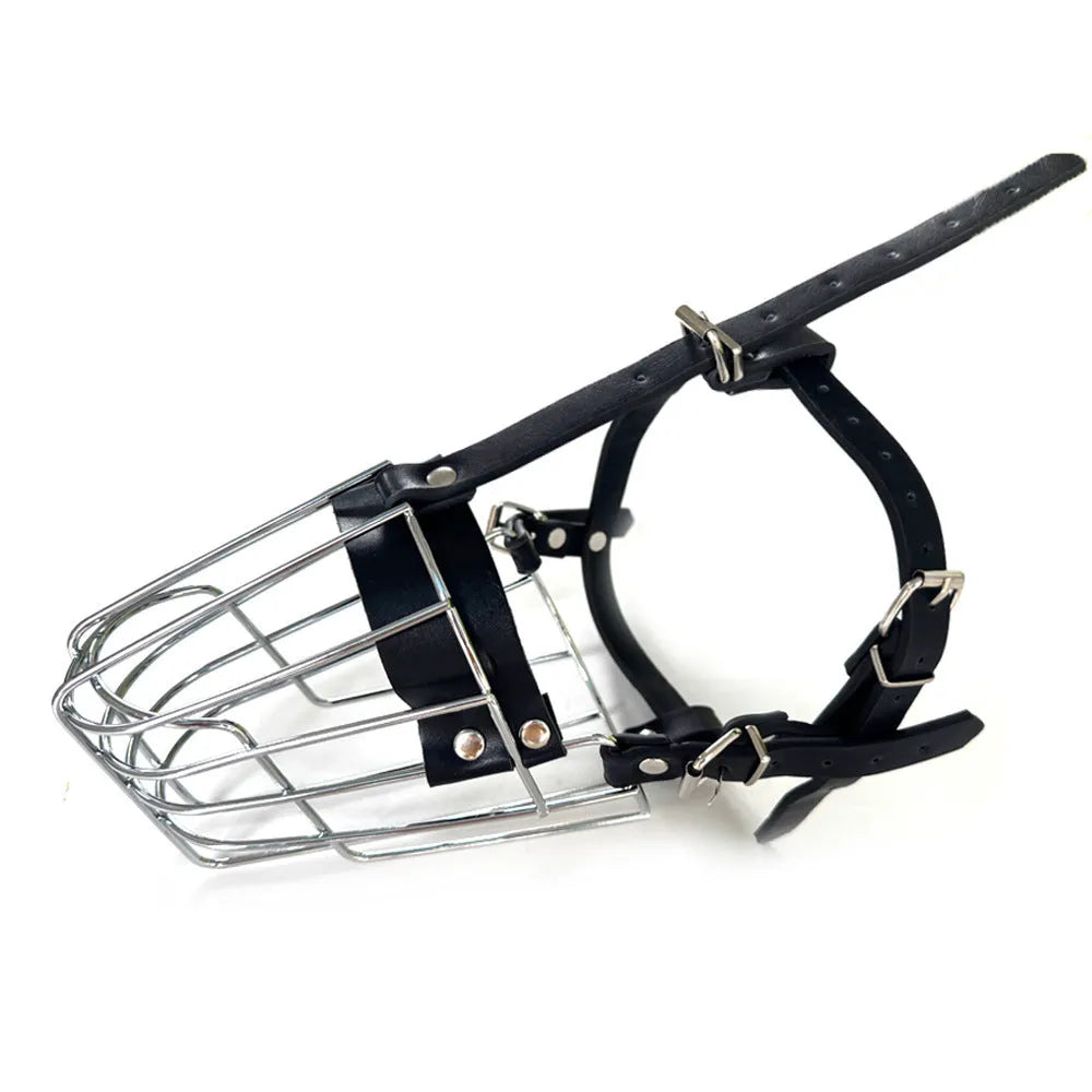 Black metal basket dog muzzle for large breeds, shown on a table with adjustable strap and buckle.
