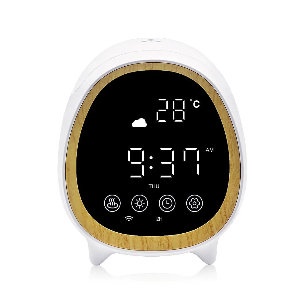 Round black smart WiFi aroma diffuser on a table with a fine cool mist rising from its top