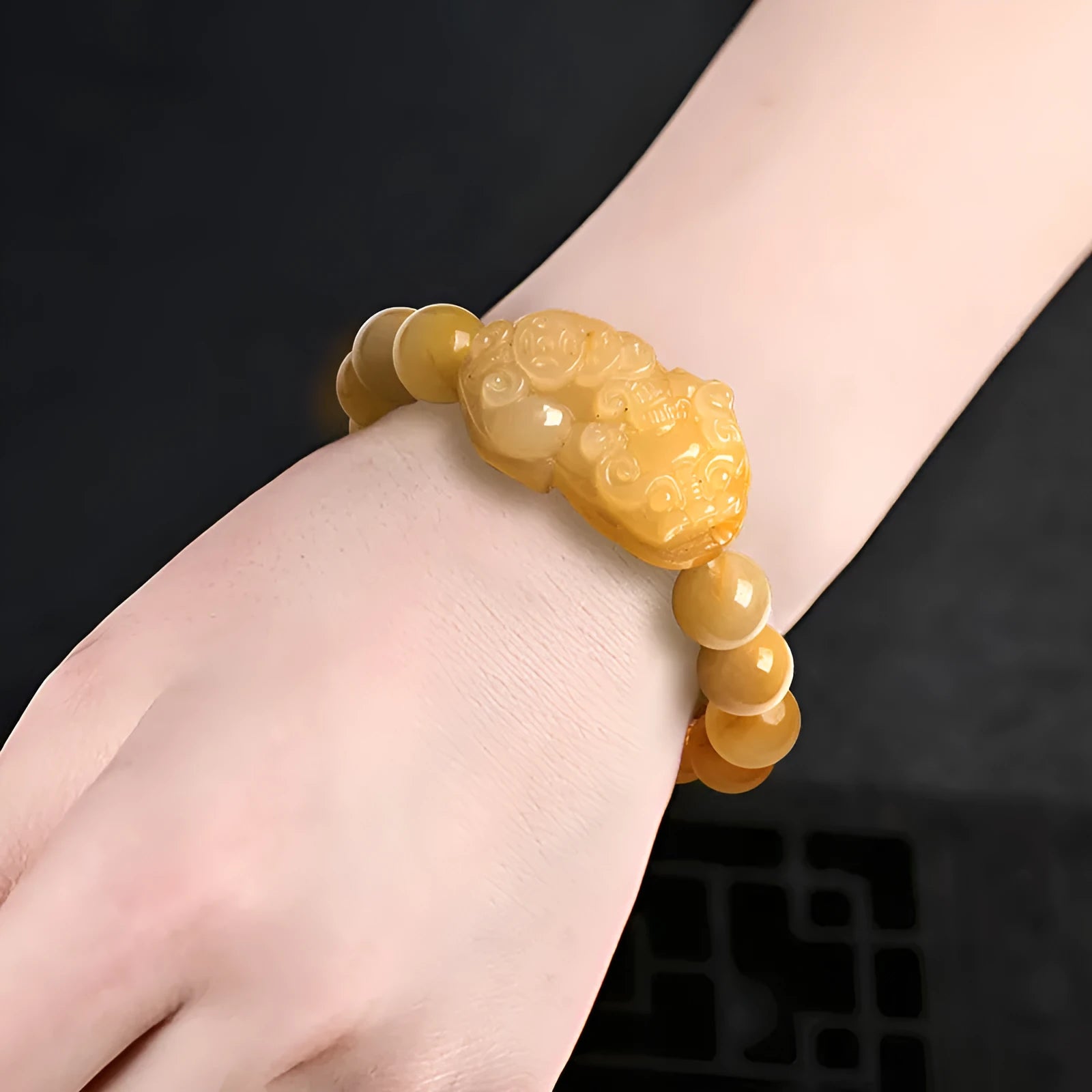 Carved Jinsi Jade money motif bracelet in Golden Thread Jade colour showing 10mm and 13mm bead size options.