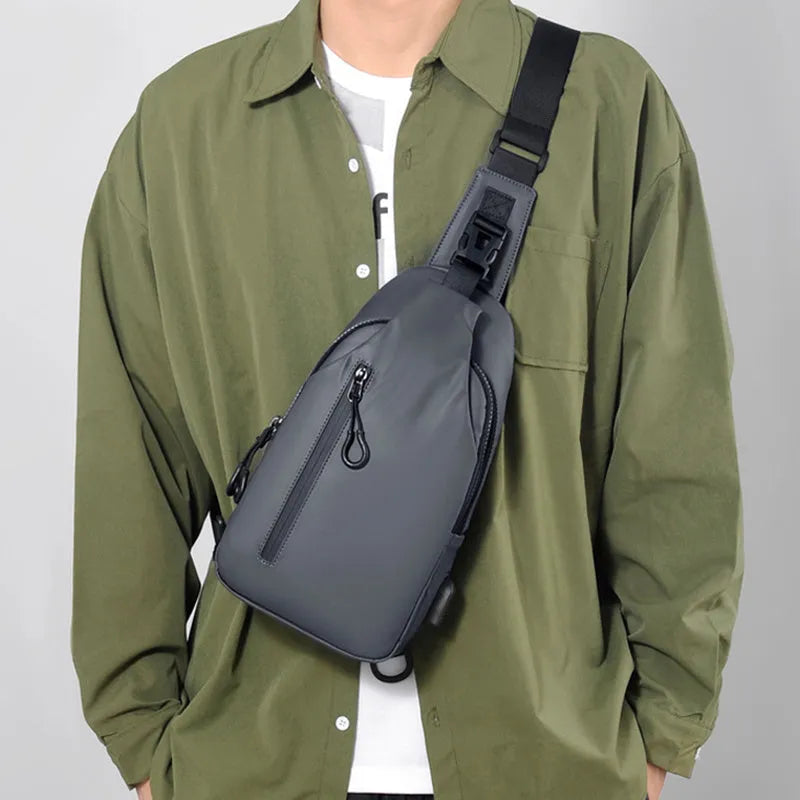 Black sling crossbody backpack for men with zipper and polyester lining, vertical square shape, solid colour design