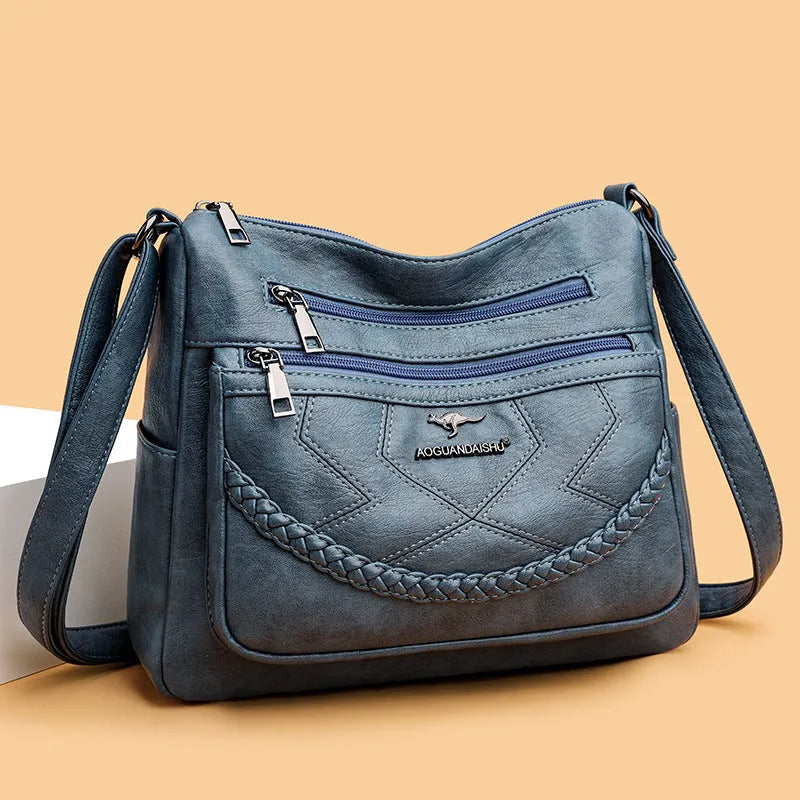 Soft black PU leather women's crossbody shoulder bag with a square shape on a white background.