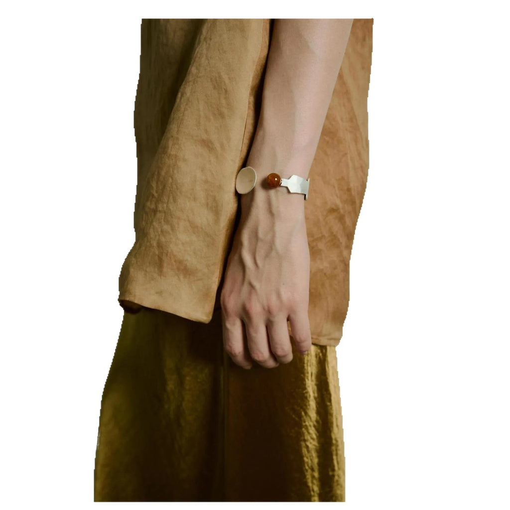 Small electroplated alloy jewellery piece with a diamond shape, shown as a bracelet or ring option.
