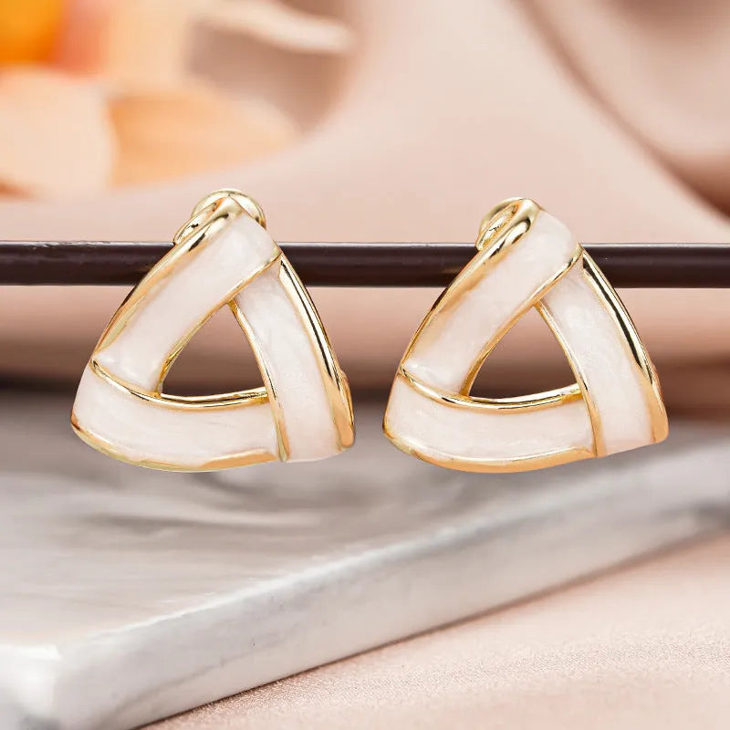 Women's metal oil stud earrings with inlaid zircon, geometric triangle shape, yellow gold finish on copper