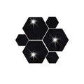 Hexagonal silver PS mirror wall sticker on a wall surface close up