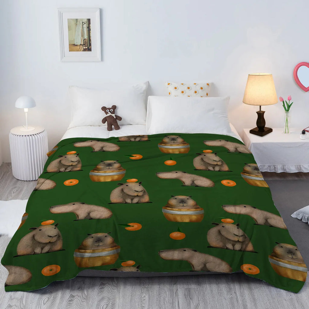 Orange and capybara pattern flannel fleece blanket in multicolour, soft fluffy throw for sofa, bed, camping and office naps