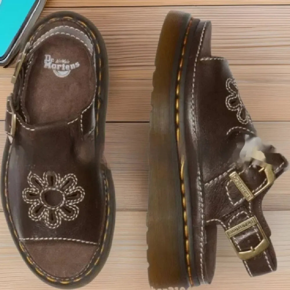 Men's black embroidered floral beach sandals with a flat heel on a white background.