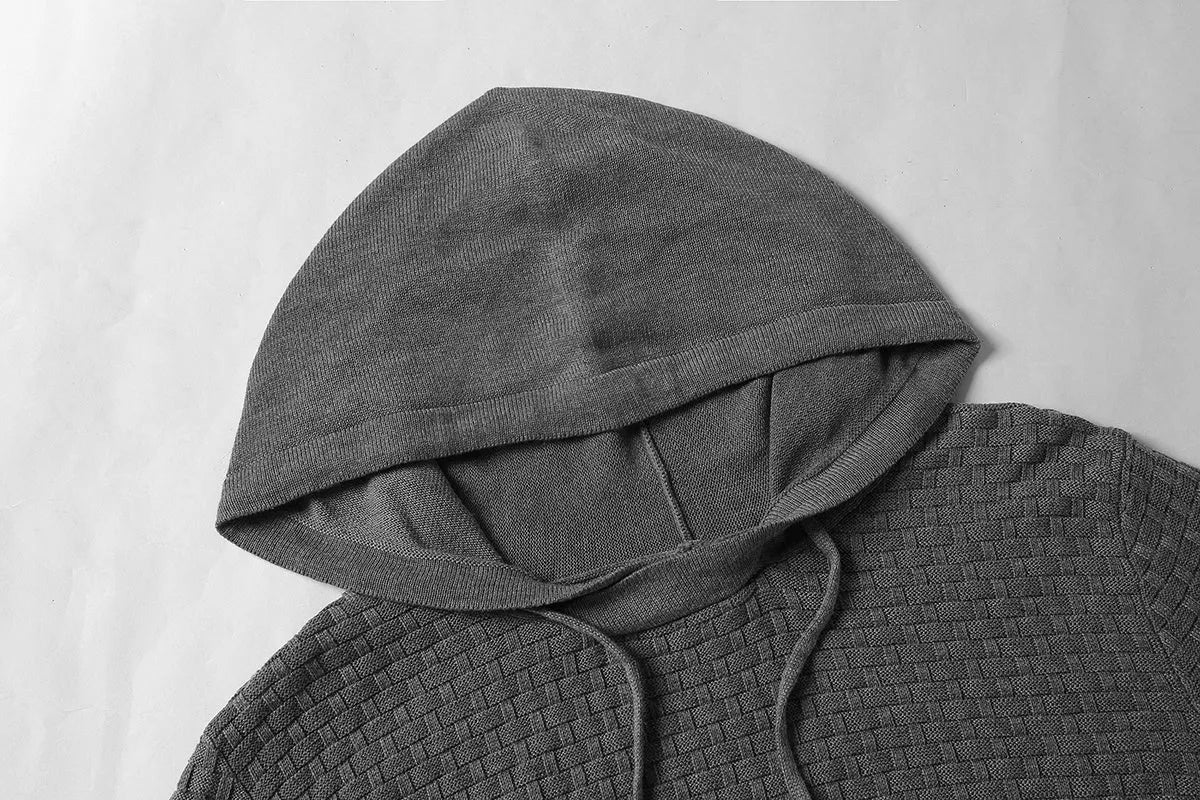 Men's black cotton-polyester hooded sweatshirt on a hanger, showing the front and hood.