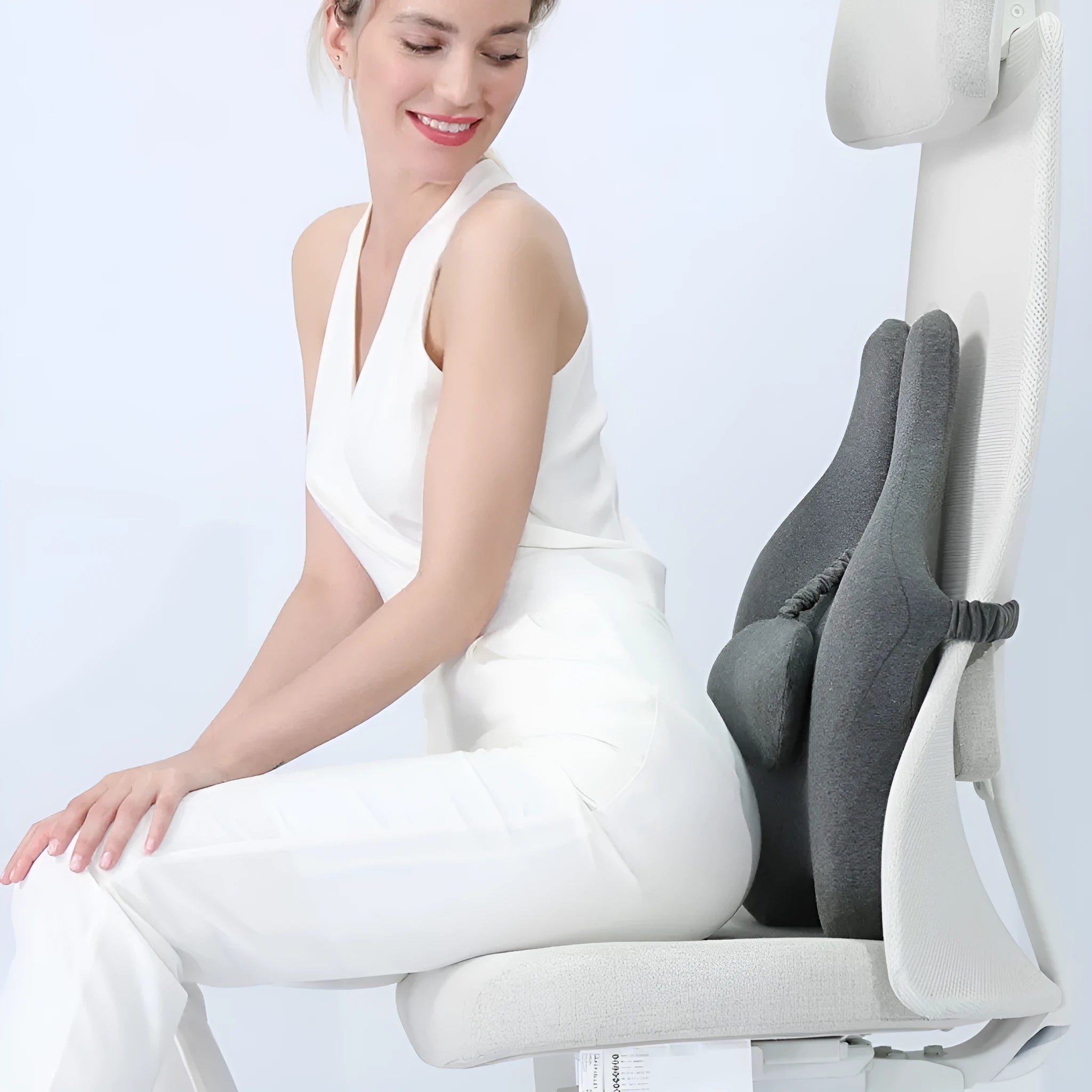 Black memory foam car lumbar support cushion showing simple solid colour design.