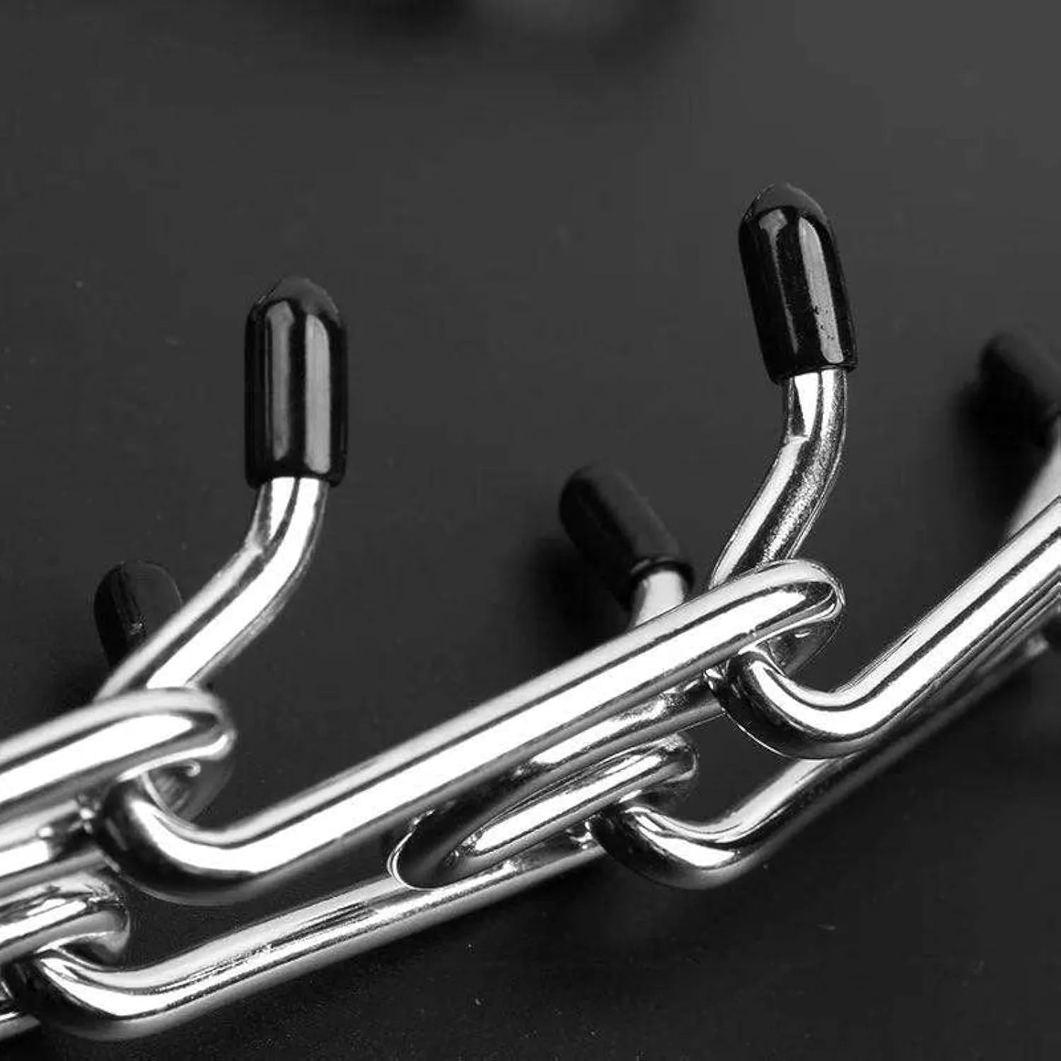 Stainless steel dog training pinch collar with rubber comfort tips on adjustable chain links