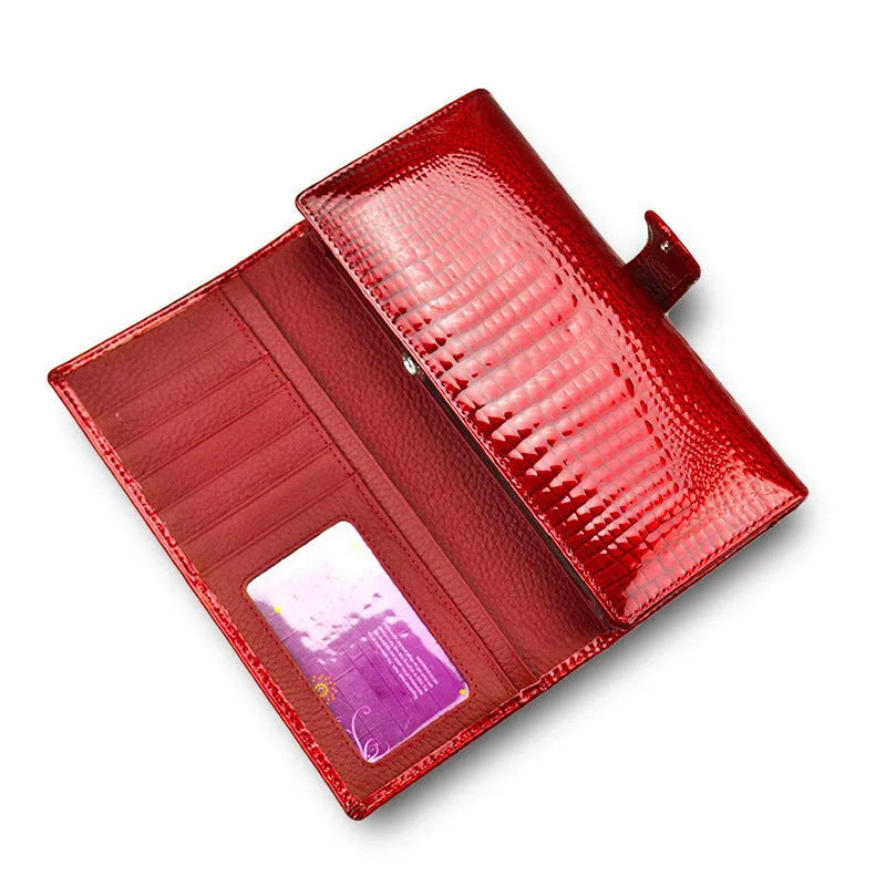 Women's red crocodile pattern patent leather coin purse with pigskin lining.