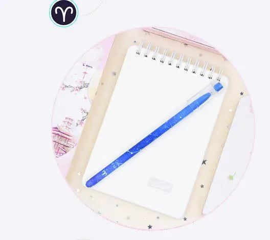 Box of 12 constellation-themed quick-drying gel pens with plastic bodies and coloured caps