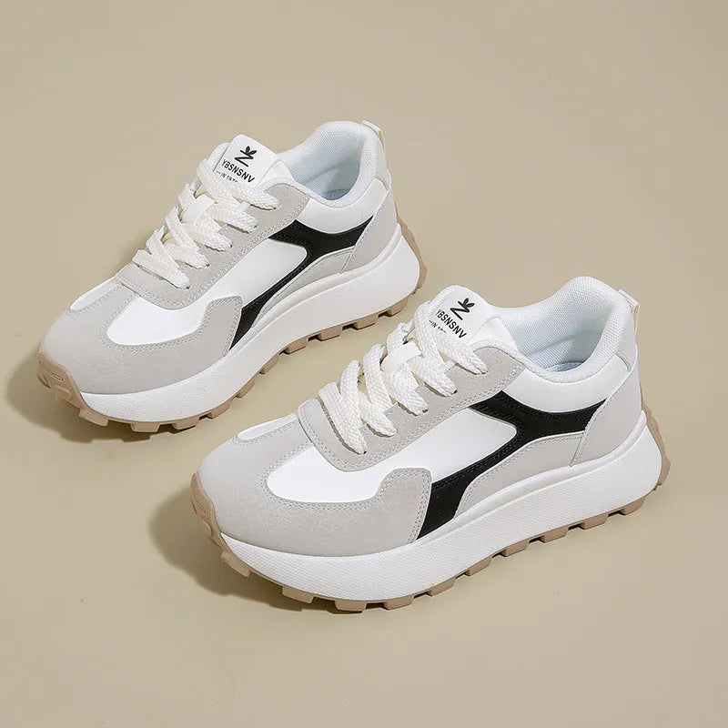 Women's solid colour platform sneakers with lace-up front and flat rubber sole.
