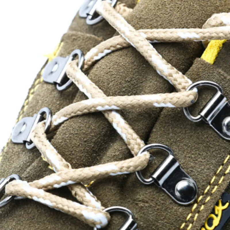 Bronze coloured low-cut leather safety boots with a steel toe cap and textured anti-skid sole.