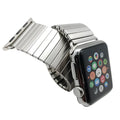 Silver stainless steel elastic Apple Watch band on a wrist, compatible with 38mm to 44mm cases