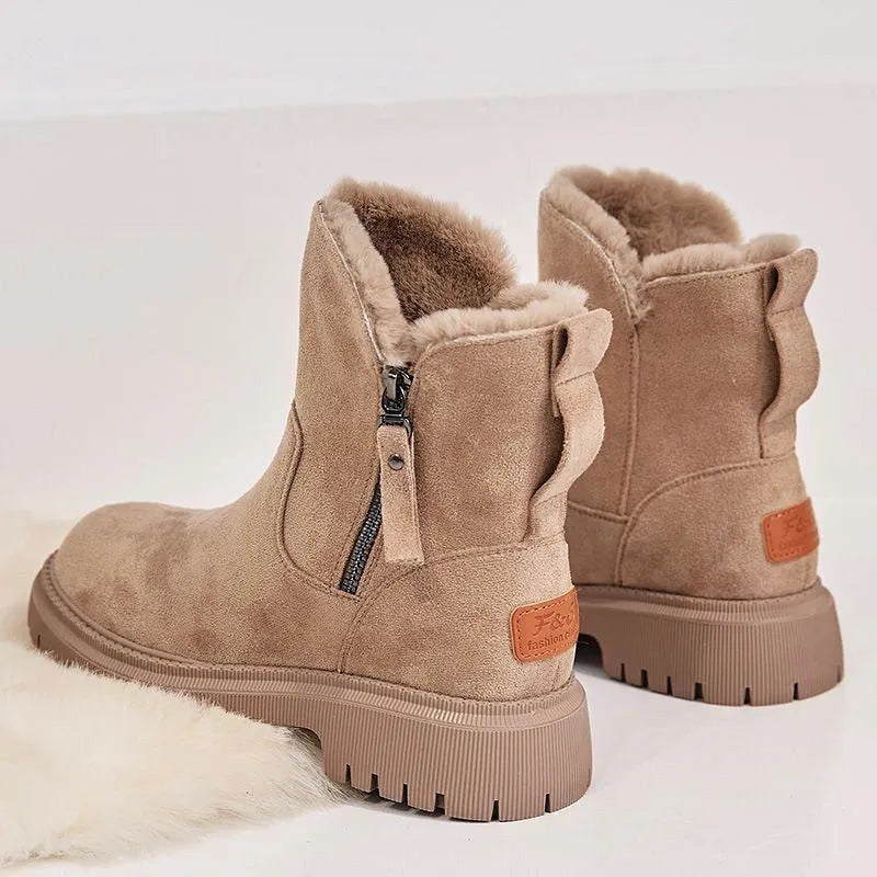 Women's black thick plush snow boots with side zipper and faux suede upper on a non-slip rubber sole.