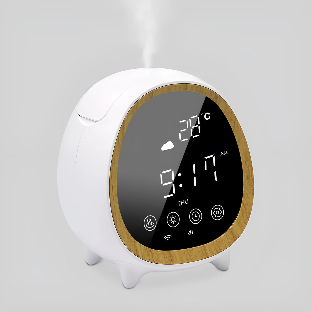 Round black smart WiFi aroma diffuser on a table with a fine cool mist rising from its top
