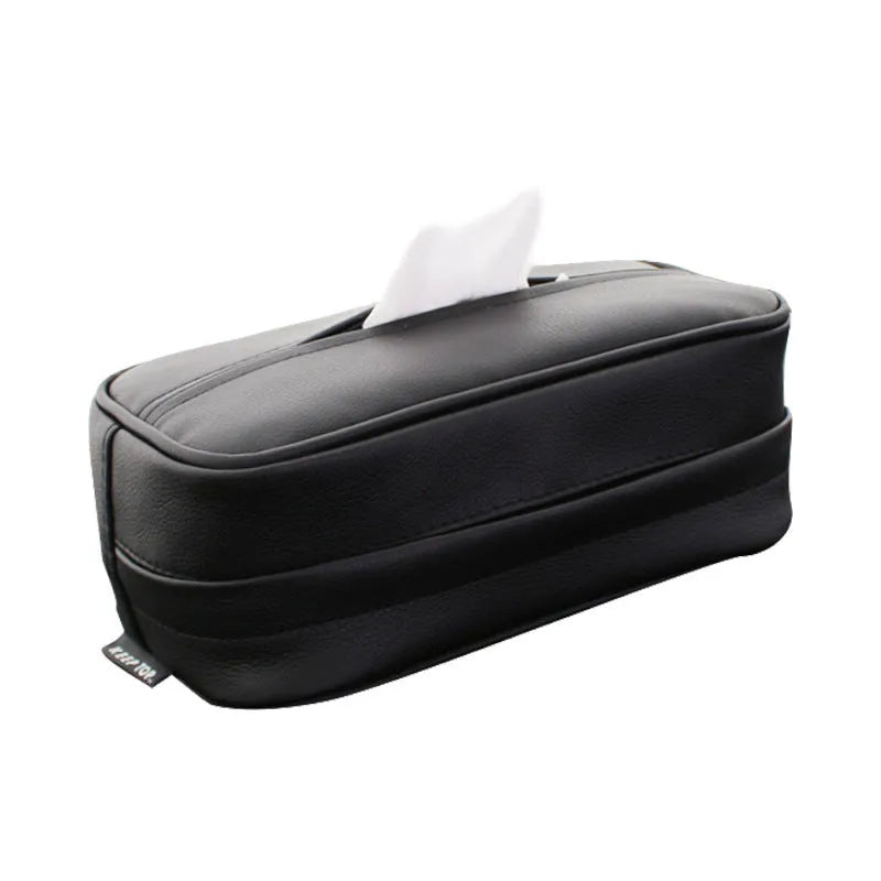 Black PU leather box with hanging loop on a car seat.