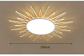 Modern round aluminium ceiling lamp with remote control for dimming, shown in a living room setting.